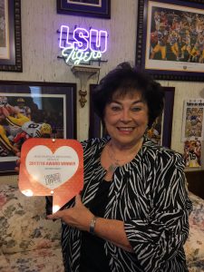 Sandra proudly showing us her award!